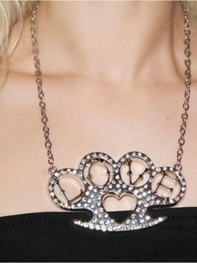 ISO any rock rebel brass knuckle necklace!